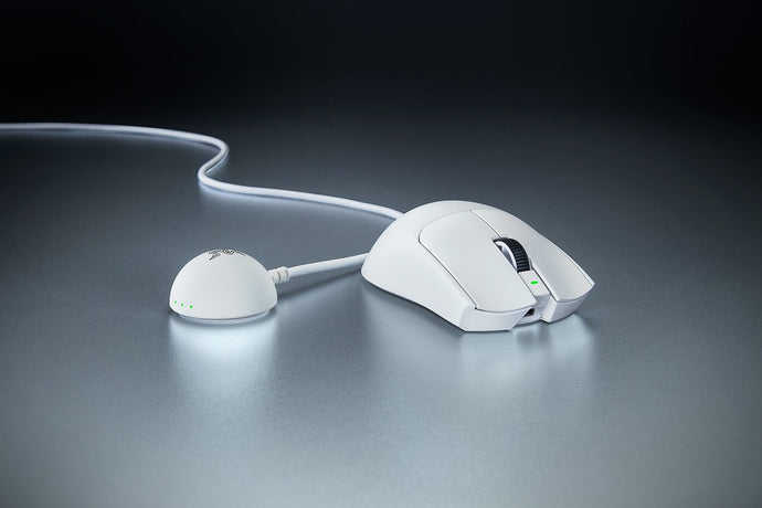White Viper V4 Pro beside its wireless receiver on a desk